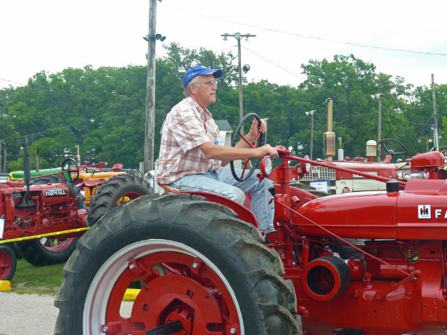 Vintage Red FarmAll Tractor in Sunday's Antique Tractor Parade at the Fair