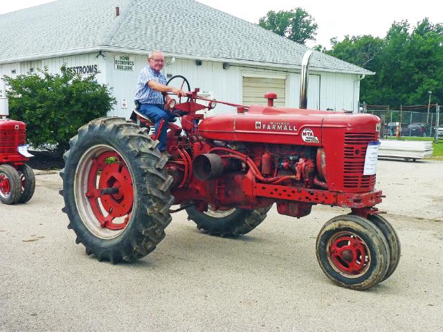 Vintage Red McCormick Farmall Tractor in Sunday's parade at the fair