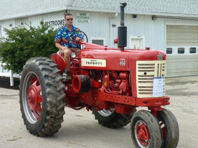 1950's red and white McCormick Farmall Diesel 450 tractor in Sunday's parade at the fair