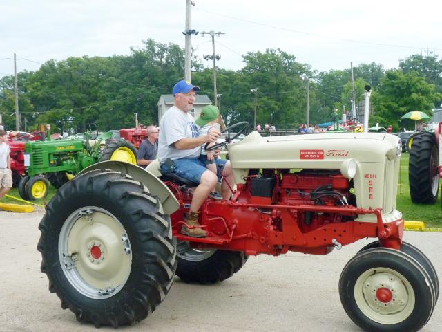 Red and Off-White Ford Tractor Model 960 in Monday's parade at the fair