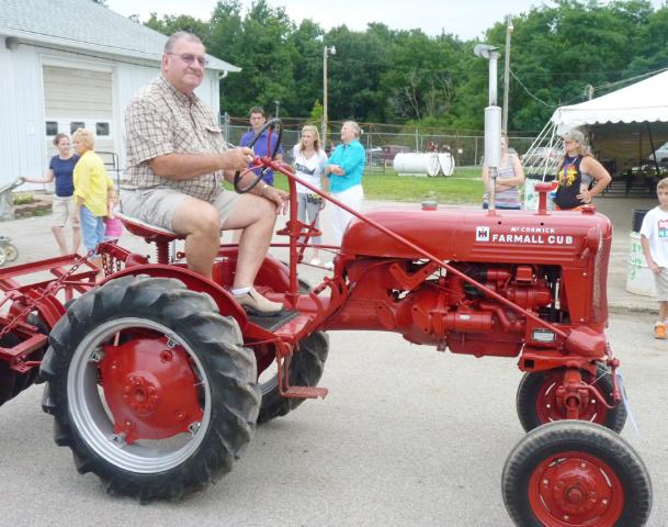 Red McCormick Farmall Cub Tractor in Monday's parade at the fair