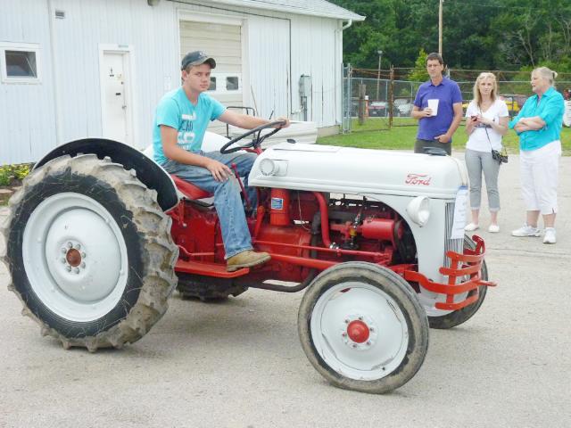 Model A Red and Cream-Colored Ford Tractor in Monday's Parade at the fair