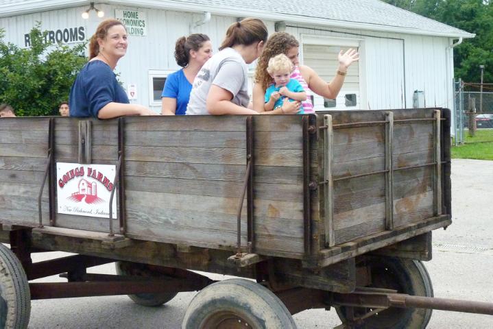 Wagon pulled by 1937 Farmall Tractor in Monday's Parade at the fair